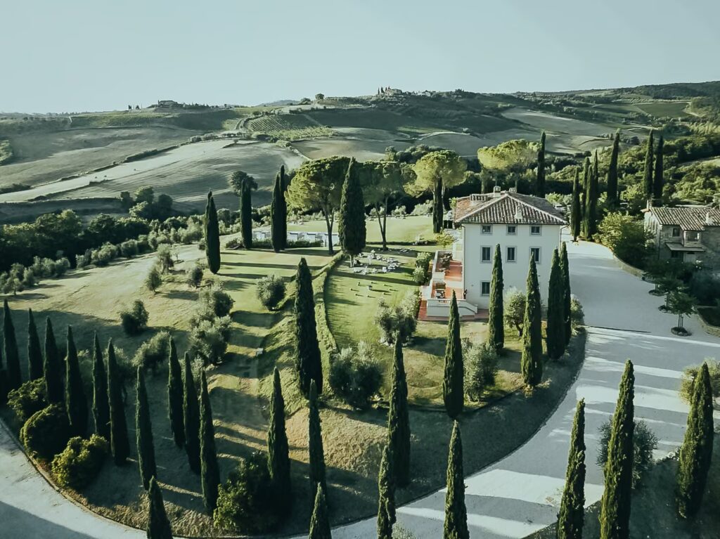Cypress-lined driveway leading to One Belvedere Tuscany estate in Chianti