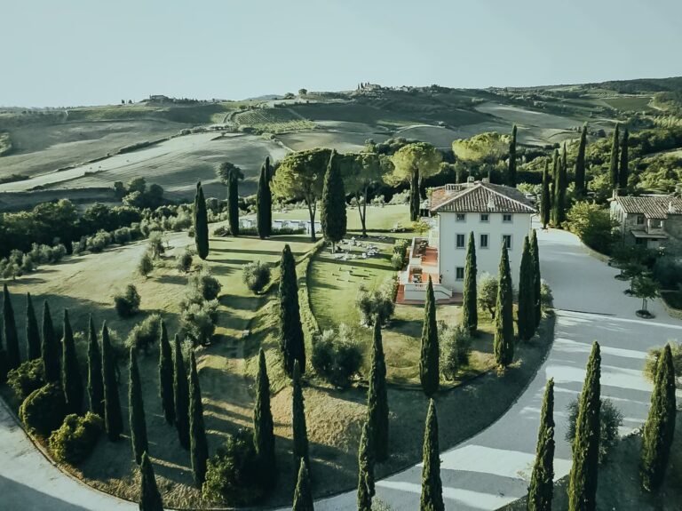 Cypress-lined driveway leading to One Belvedere Tuscany estate in Chianti