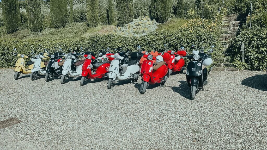 Outdoor experiences in Tuscany with colorful Vespa scooters ready for countryside exploration at One Belvedere Tuscany