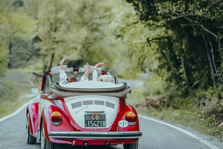 Guests enjoying outdoor experiences in Tuscany during a scenic drive through the Chianti Classico countryside near One Belvedere Tuscany