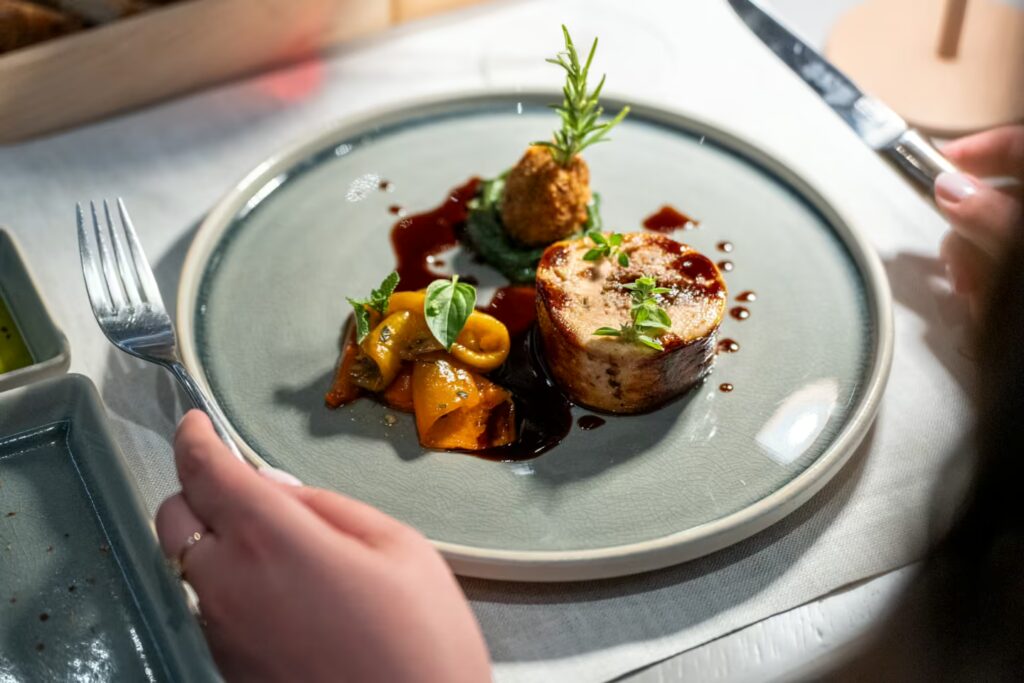 Dish from Tavola Le Piazze showcasing seasonal Tuscan cuisine