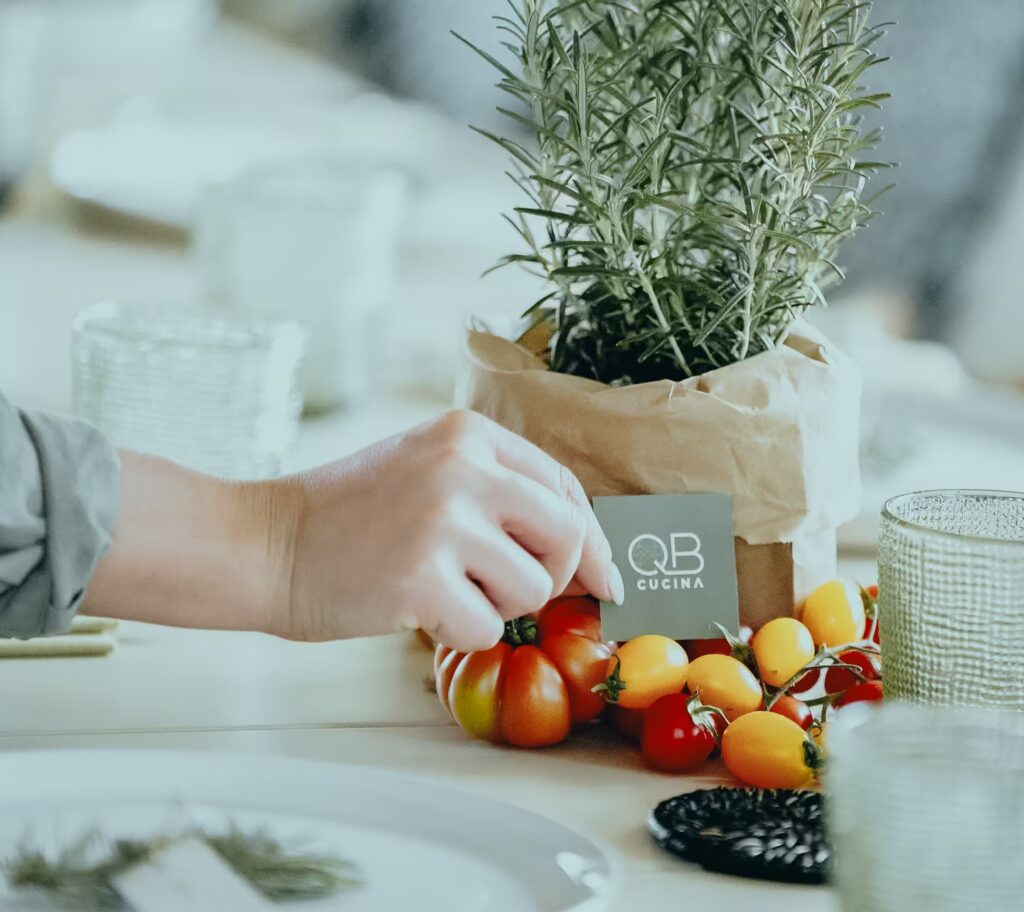 Fresh tomatoes and rosemary reflecting QB Cucina's kitchen garden this August at One Belvedere Tuscany.