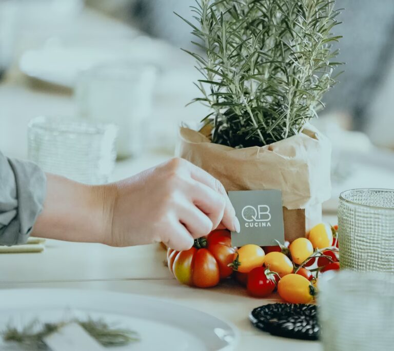 Fresh tomatoes and rosemary reflecting QB Cucina's kitchen garden this August at One Belvedere Tuscany.